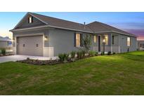 Charming single-story home with a well-manicured lawn and a two-car garage at 7337 Sw 89Th Ter, Ocala, FL 34481