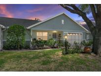 Charming single-story home with a well-manicured lawn and inviting front porch at 9661 Sw 95Th Ct # B, Ocala, FL 34481