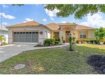 Charming single-story home with a well-manicured lawn and inviting curb appeal at 9663 Sw 92Nd Place Rd, Ocala, FL 34481