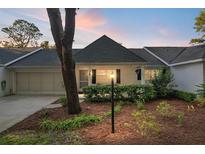 Charming single story home with a well-manicured front yard and welcoming entrance at sunset at 8681 Sw 93Rd Pl # B, Ocala, FL 34481