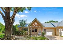 Charming single-story villa with well-maintained landscaping and attached one-car garage at 9330 Sw 84Th Ter # A, Ocala, FL 34481