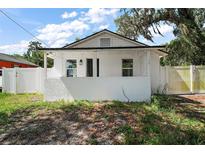 Charming renovated single-Gathering home with a quaint porch and a well-maintained, fenced yard at 719 Nw 8Th St, Ocala, FL 34475