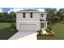 Charming two-story home with a two-car garage and beautifully landscaped front yard at 8510 Las Palmas Way, Wildwood, FL 34785