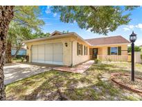 Charming single-story brick home with a two-car garage and well-maintained landscaping at 9266 Sw 91St Cir, Ocala, FL 34481