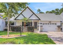Charming home boasts a well-maintained lawn, attractive landscaping, and a welcoming two-car attached garage at 8785 Sw 93Rd Ln # C, Ocala, FL 34481