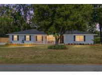Charming single-story home featuring a brick facade and mature landscaping at 1812 Se 38Th Ave, Ocala, FL 34471
