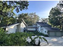 Contemporary two-story home with a three-car garage and lush landscaping at 4305 Sw 20Th Ave, Ocala, FL 34471