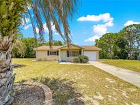 Charming single-story home with a well-maintained lawn and inviting curb appeal at 10520 Sw 85Th Ter, Ocala, FL 34481