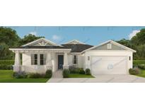 Charming single-story home with a well-manicured lawn and a welcoming front porch at 5830 Sw 121St Ter, Ocala, FL 34481