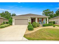 Charming single-story home with a well-manicured front yard and a two-car garage at 7917 Sw 85Th Loop, Ocala, FL 34476