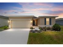 Charming single-story home with a well-manicured lawn and beautiful landscaping, plus a two car garage at 5842 Sw 78Th Avenue Rd, Ocala, FL 34474