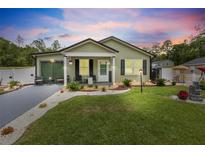 Charming single story home featuring a manicured lawn and attractive landscaping at 15324 Sw 40Th Place Rd, Ocala, FL 34481