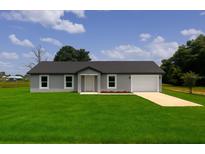 Charming one-story home featuring a well-maintained lawn and a single-car garage at 3529 Sw 150Th Ct, Dunnellon, FL 34432