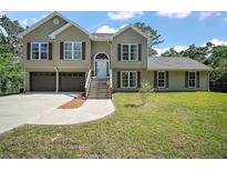 Charming home boasts classic siding, double garage, and well-maintained front lawn at 4673 Se 115Th St, Belleview, FL 34420
