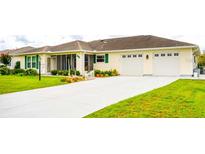 Charming single-story home with a well-manicured lawn, two-car garage, and screened-in porch at 6190 Sw 84Th Pl, Ocala, FL 34476