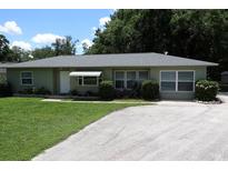 Charming single-story home with a well-manicured lawn and inviting curb appeal at 2810 Se Lake Weir Ave, Ocala, FL 34471