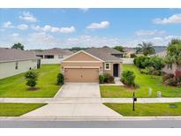 Charming single-Gathering home featuring a well-manicured lawn and a two-car garage at 6318 Sw 89Th Lane Rd, Ocala, FL 34476