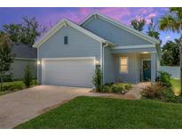 Charming one-story home boasts a brick driveway, two-car garage, and lovely landscaping, perfect for curb appeal at 1814 Nw 44 Court Rd, Ocala, FL 34482