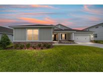 Charming one-story home with stone accents and a well-manicured lawn at 7513 Sw 56Th Pl, Ocala, FL 34474