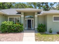 Charming single-story home with well-manicured landscaping and a welcoming front entrance at 11645 Mallard Ct, Dunnellon, FL 34432