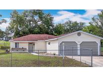 Charming single-story home with a fenced yard and a two-car garage at 70 Sapphire Rd, Ocala, FL 34472