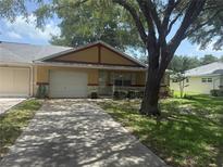 Charming single-story home featuring a well-maintained lawn and a private driveway at 9722 Sw 95Th Ct # C, Ocala, FL 34481