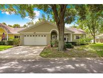 Charming one-story home with a well-manicured lawn, a two-car garage, and a welcoming front entrance at 9587 Sw 84Th Ter # E, Ocala, FL 34481
