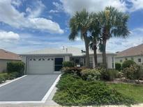 Charming single-story home with well-maintained landscaping and attached two-car garage at 9730 Sw 90Th St, Ocala, FL 34481