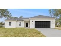Charming single-story home with a modern design, neutral colors, and an attached two-car garage at 1686 Sw 168Th Loop, Ocala, FL 34473
