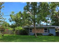 Charming single story home with brick accents, mature trees, and a well-maintained lawn at 3709 Ne 4Th St, Ocala, FL 34470