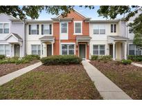 Charming townhome with a colorful facade, well-maintained landscaping, and inviting entryway at 4429 Sw 49Th Ave, Ocala, FL 34474