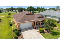Beautiful single Gathering home with a well maintained lawn and a two car garage at 9236 Sw 91St Court Rd, Ocala, FL 34481