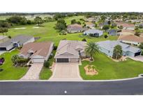 Beautiful aerial view of homes with well-manicured lawns near a golf course community at 15549 Sw 11Th Terrace Rd, Ocala, FL 34473