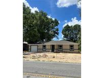 Charming single-story home with a new driveway and fresh landscaping at 19622 Sw Marine Blvd, Dunnellon, FL 34431