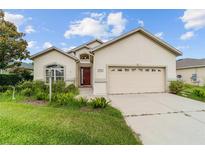 Charming single-story home with a two-car garage and a well-maintained front yard landscape at 6299 Sw 90Th St, Ocala, FL 34476