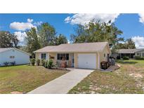 Charming single-story home with well-maintained lawn and inviting front porch at 8144 Sw 108Th Street Rd, Ocala, FL 34481