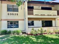 Two story building with balconies and manicured landscaping at 3525 E Fort King St # 145, Ocala, FL 34470