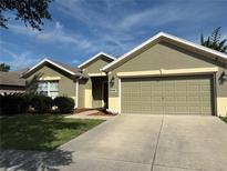 Charming single-story home featuring a two-car garage and well-manicured lawn in a tranquil neighborhood at 3950 Sw 54Th Ct, Ocala, FL 34474