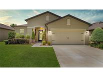 Charming single-Gathering home featuring a well-manicured lawn and a two-car garage at 9634 Sw 67Th St, Ocala, FL 34481