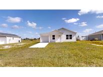 Charming single-story home featuring a well-maintained lawn, attached garage, and inviting curb appeal at 2740 Sw 147Th Ter, Ocala, FL 34481