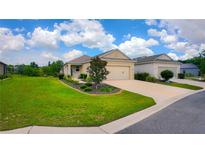 Charming single-Gathering home featuring a well-manicured lawn and inviting curb appeal at 7765 Sw 86Th Loop, Ocala, FL 34476