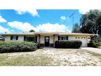 Charming single-story home featuring a neutral exterior, tidy landscaping, and an attached one-car garage at 16905 Sw 30Th Avenue Rd, Ocala, FL 34473