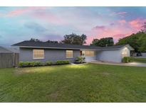 Charming one-story home with a well-manicured lawn and lush landscaping for a picturesque curb appeal at 5500 Se 2Nd Pl, Ocala, FL 34480