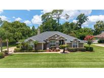 Charming single-story home with a well-manicured front lawn and mature landscaping, creating a welcoming curb appeal at 2908 Se 22Nd Ave, Ocala, FL 34471