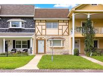 Charming townhouses featuring unique facades, manicured lawns, and inviting entrances at 8830 Sw 98Th Pl # M, Ocala, FL 34481