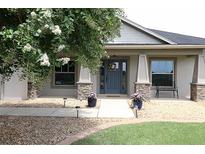 Charming home featuring a decorative front door, stone accents, and blooming landscaping at 1829 Nw 85Th Loop, Ocala, FL 34475
