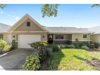 Charming single-story home featuring a well-manicured lawn and a two-car garage at 9460 Sw 84Th Ter # F, Ocala, FL 34481