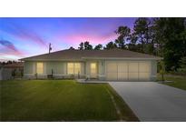 Charming single-story home with well-manicured lawn and two-car garage at 458 Marion Oaks Trail Trl, Ocala, FL 34473