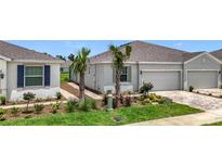 Charming single-story home featuring a two-car garage and beautifully landscaped front yard at 5233 Nw 43Rd Lane Rd, Ocala, FL 34482