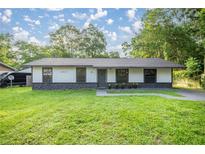 Charming single-story home with a well-maintained lawn and inviting curb appeal at 6021 Nw 54Th Ter, Ocala, FL 34482
